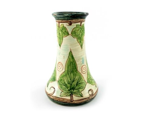 Charles Collis for Della Robbia, an art pottery vase, flared trumped form, sgraffito decorated with ivy leaves and spiral mot