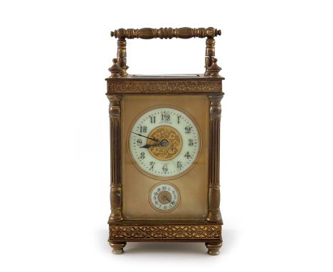 A gilt brass swiss carriage clock, the white enamelled chapter ring and subsidiary dial with Roman numerals, fluted columns a