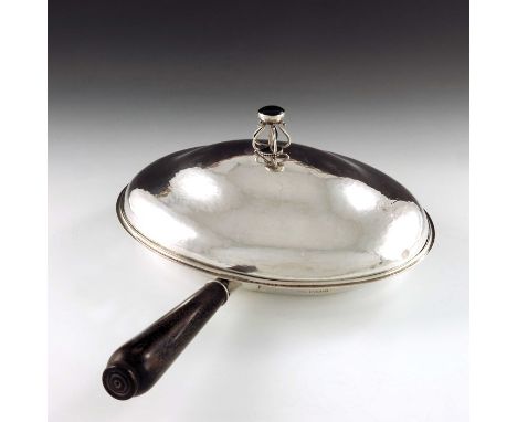 Charles Robert Ashbee for the Guild of Handicraft, an Arts and Crafts silver chafing dish, London 1907, planished oval form, 