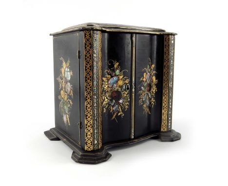 A Victorian papier mache lacquered cabinet, ogee cuboid bracket form, the double doors opening to reveal five graduated drawe