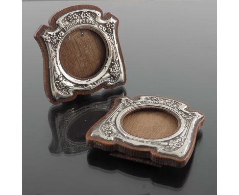 A pair of Arts and Crafts silver photo frames, Gourdel Vales and Co., Birmingham 1904, ogee bracket form, embossed with flowe