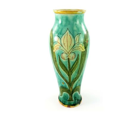 Willie Williams for Della Robbia, an art pottery vase, slender shouldered form, sgraffito decorated with iris or lily motifs 