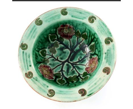 Tom Hall for Della Robbia, an art pottery bowl, ogee form with everted rim, sgraffito decorated with a briar rose and spiral 