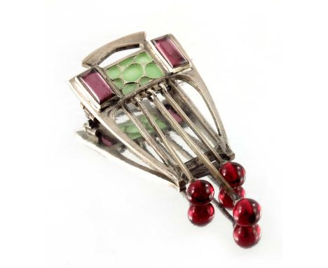 A Jugendstil plique a jour enamelled and gem set silver brooch, the open lyre form frame set with a plaque of green enamel fl