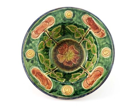 Tom Hall for Della Robbia, an art pottery bowl, wide brimmed hemispherical form, sgraffito decorated with briar roses and spi