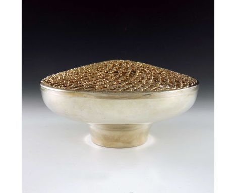 Stuart Devlin, a Modernist silver and parcel gilt rose bowl and cover, London 1977, ogee form with reticulated rusticated lat