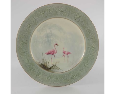 William Powell for Royal Worcester,  a cabinet plate decorated with wading flamingos in a misty river landscape, within raise