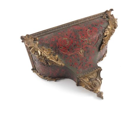 A 19th century Boulle work bracket, tortoiseshell with tooled brass inlay and gilt foliate mask mounts, 38cm wide, 19cm deep,