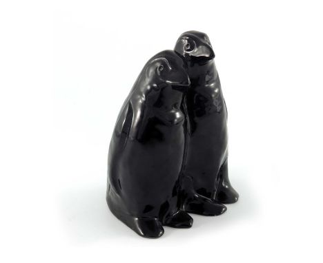 John Spencer for Pilkington, a Royal Lancastrian figure group of two penguins, circa 1936, black glazed, impressed marks, 16.