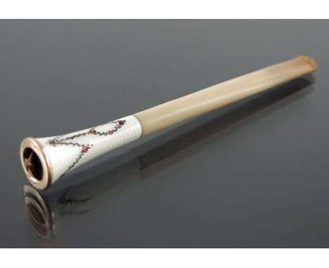 An enamelled and gold rimmed cigarette holder, the trumpet end with white guilloche enamel, painted with floral swags and pen