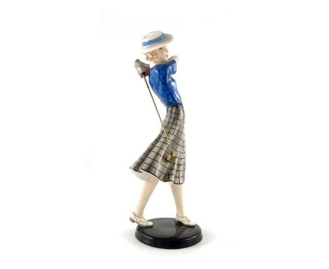 Stephan Dakon for Goldscheider, a figure of a young woman golfer, circa 1935, modelled hat, blue blouse and skirt, incised an