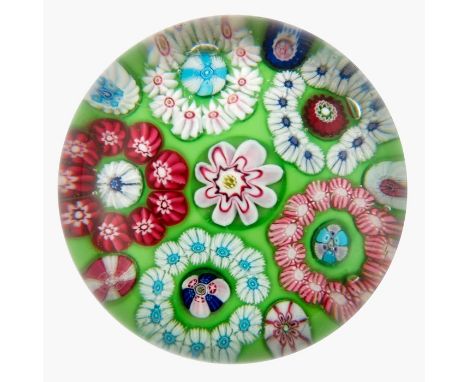 Clichy, patterned millefiori paperweight, large central pink and white cane, surrounded by five garland rings each ring surro