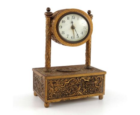 A gilt metal automaton alarm clock, with spring loaded chirping bird to the base casket, two columns supporting an oval drum 