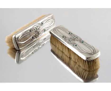 Kate Harris for William Hutton, a pair of Arts and Crafts silver and enamelled clothes brushes, London 1903, embossed in the 