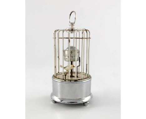 A Kaiser novelty chrome plated birdcage alarm clock, with ticking bird seconds marker and revolving pedestal drum chapter rin