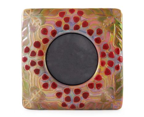 Zsolnay Pecs, a Secessionist lustre photo frame, circa 1905, square with circular aperture, relief moulded with stylised frui