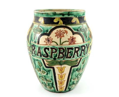 John Fogo and Tom Hall for Della Robbia, an art pottery fruit or jam jar, ovoid form, sgraffito decorated with a banner readi