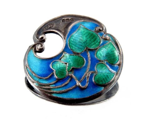 An Arts and Crafts silver and enamelled brooch, Marples and Beasley, Birmingham 1909, open scroll form cast with green basse 