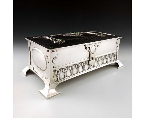 Kate Harris for Goldsmiths and Silversmiths Company, a large Arts and Crafts silver presentation cigar casket, London 1901, r