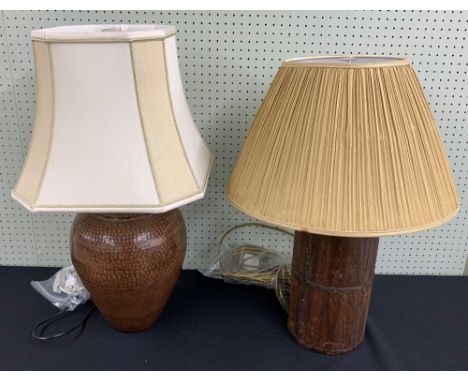 Decorative metal baluster table lamp with beaten effect, 17" high to top of fitting, with shade; together with a cylindrical 