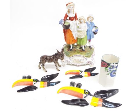 Dresden 'Yardley's Old English Lavender' porcelain figural group, 12" high; a set of three reproduction Guinness toucan gradu