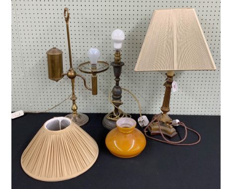 Three table lamps including a vintage brass counterbalanced lamp, 22" high, a painted turned wooden table lamp and a brass Co