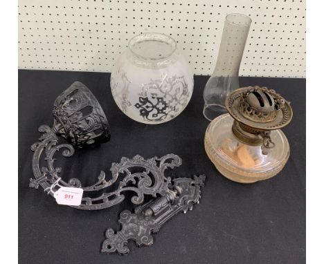 Victorian painted brass wall bracket and glass oil lamp, the scrolling cast hinged bracket and bowl with reverse stamp regist