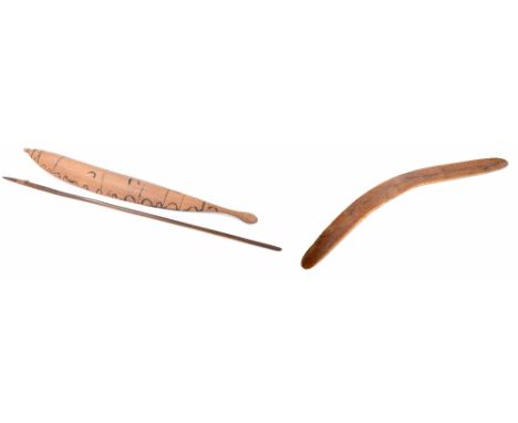 Aboriginal boomerang, with carved serpent decoration over the top side, 23.5" long; together with an Aboriginal woomera (spea