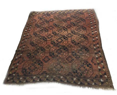 Persian patterned orange ground carpet, decorated with triple medallion run within geometric border, 93" x 80"
