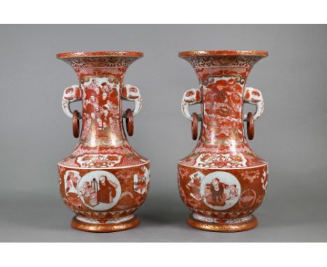 A pair of 19th century Japanese Kutani vases, Meiji period (1868-1912) with elephant mask loose ring handles, painted with va