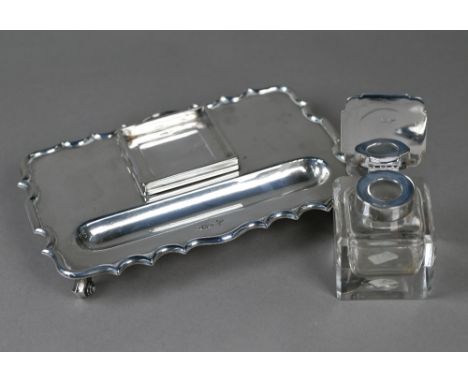 A heavy quality silver inkstand with silver-topped square cut glass inkwell, shaped rim and four scroll feet, Walker &amp; Ha