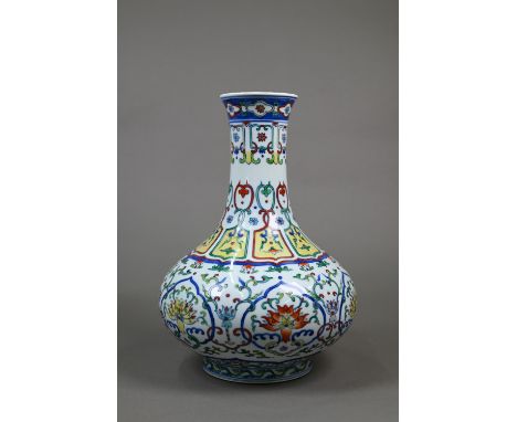 A Chinese doucai pear-shaped vase, painted in underglaze blue and polychrome enamels with interlinking lappets and ruyi-shape