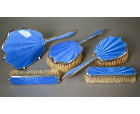 An Art Deco blue guilloche enamel and silver five-piece brush set, Harrods, London 1940 . Mirror and one brush with chipped e