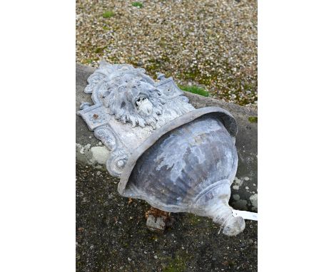 An old weathered lead lion mask wall fountain with lion head spout over a half-round basin, 76 cm h All complete, no dents or