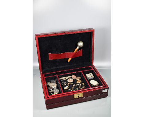 A burgundy jewel case with lift out tray with a quantity of antique and later jewellery including a pale jade and enamel whit