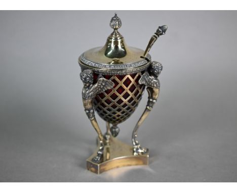 A late Victorian Adam Revival silver gilt sucrier and cover with ruby glass liner, with foliate finial and urn-shaped body su