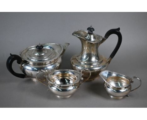 A silver four-piece tea service in the Regency manner, with gadrooned Empire rim and composite mounts, Harrods Ltd, London 19