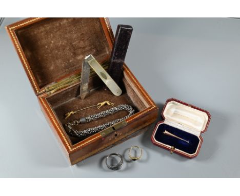 A small leather jewel box with bloodstone set ring, hare and hound stick pin, bugle pin brooch in fitted box, fancy link brac