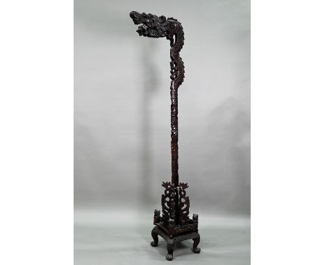 An early 20th century Chinese carved hardwood dragon design lamp/lantern stand, 180 cm high&nbsp; 