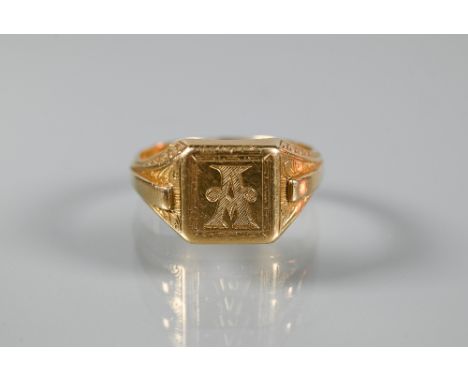 An 18ct yellow gold signet ring with carved shoulders and monogrammed 'A' to face, size Y, approx 14.9gGood condition with on