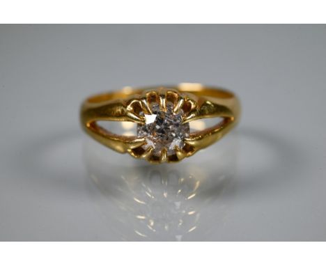 A Victorian single stone diamond ring in yellow gold, the old European cut stone claw set in a gentleman's type mount with op