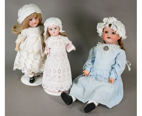 An Armand Marseille 1330 A7M bisque-headed girl doll with plaited red wig, closing blue eyes with lashes and open mouth with 