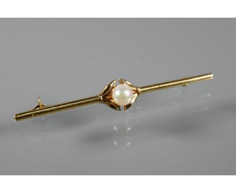 Mikimoto - A yellow metal bar brooch with central pearl, stamped Mikimoto Tokyo KI4, 6.5 cm long, 4.4 g all in to/w&nbsp;mixe