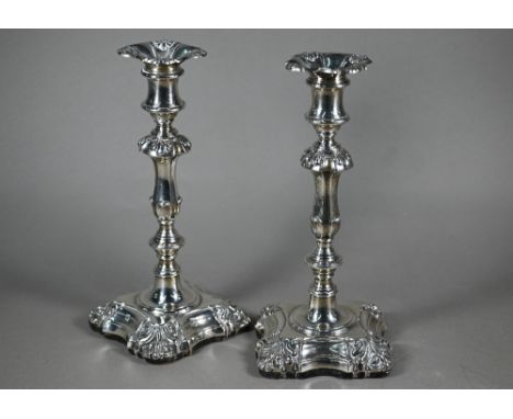 A pair of William IV loaded silver baluster candlesticks with detachable grease-pans, on wooded bases, Henry Wilkinson &amp; 