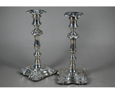 A pair of William IV loaded silver baluster candlesticks with detachable grease-pans, on wooded bases, Henry Wilkinson &amp; 