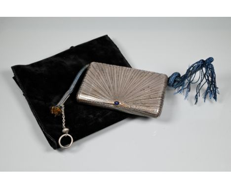 A Russian silver cigarette and vesta case of hinged rectangular form with radial sunburst design, with gold clasp, cabochon s