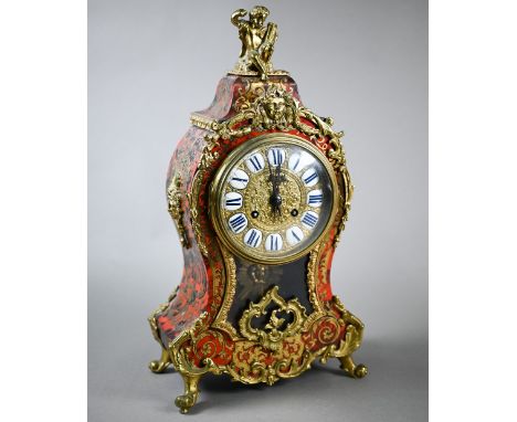 An Art Nouveau brass mounted and inlaid tortoiseshell mantel clock, the two train 8-day movement striking on a bell, gilt dia