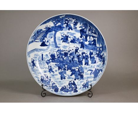 A 20th century Chinese blue and white 'hundred boys' pattern charger, decorated in underglaze blue with children at play in a