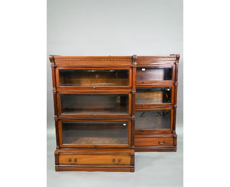 A companion pair of mahogany Globe Wernicke library bookcases, each with moulded tops over three graduated glass fronted cabi