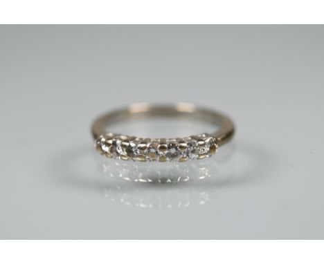 A seven stone diamond ring, 18ct white gold set, size O, 0.50 carats, approx 3.7g all in 